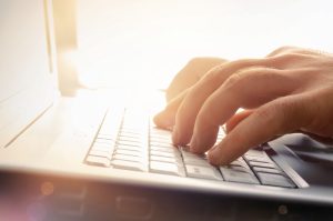Man’s,Hands,Typing,On,Laptop,Keyboard