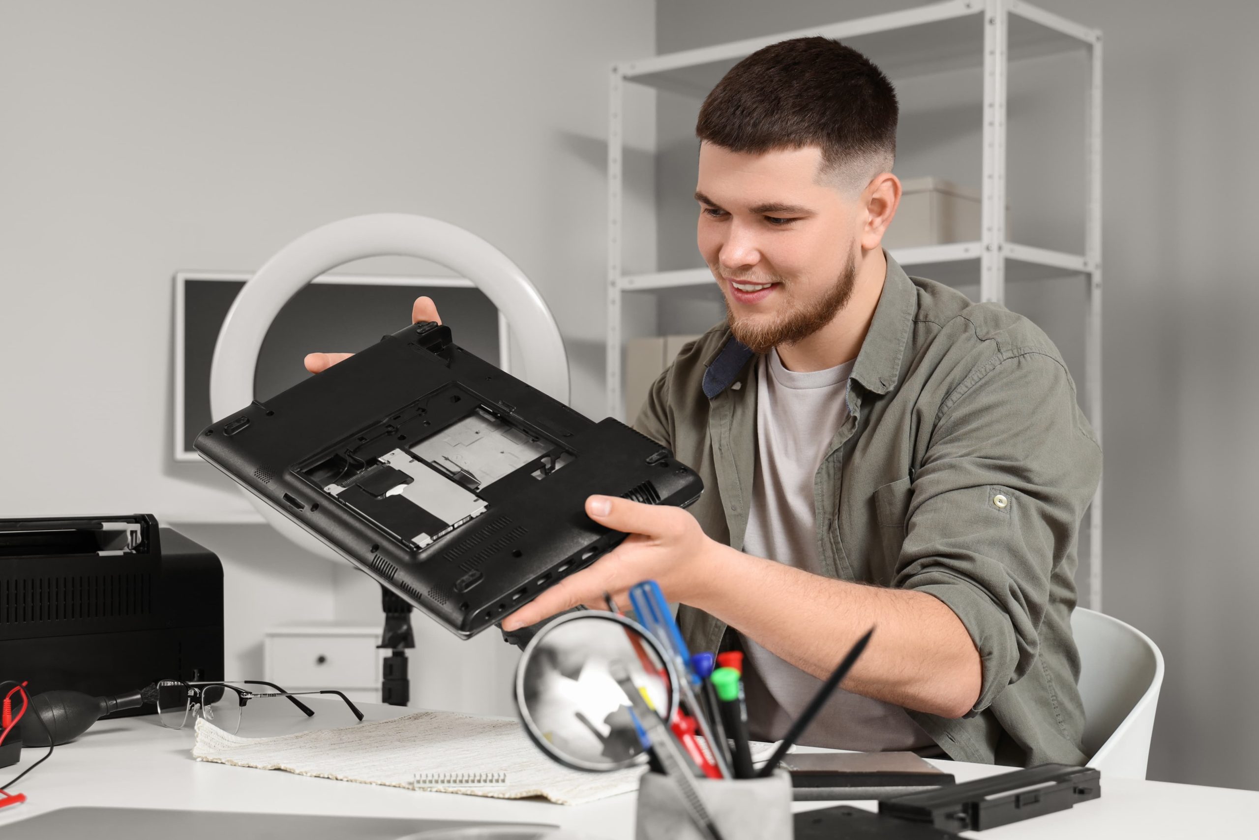 male-technician-repairing-laptop